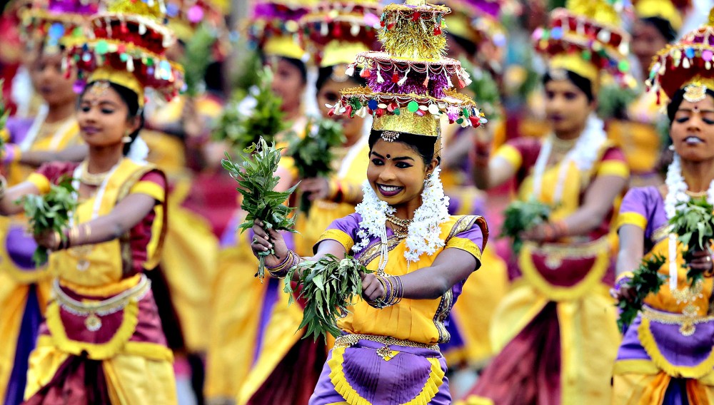 Sri Lankan ethnic Tamil dancers from northern province perform during Independence Day celebrations in Colombo, Sri Lanka, Wednesday, Feb. 4, 2015. Sri Lanka has failed to heal its deep ethnic divide since the end of the nation's civil war five years ago, the president acknowledged Wednesday in a major speech calling for national reconciliation. (AP Photo/Eranga Jayawardena)