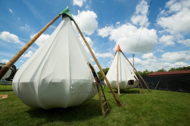 The luxury Pop-Up Hotel at Glastonbury Festival, Pilton, Somerset. (file photo) See SWNS story SWPOOL; Luxury at this yearís Glastonbury Festival will reach new heights with a extravagant pop-up hotel with its own SWIMMING POOL. Revellers who donít fancy staying in a cramped tent - and have up to £13k to spare - could find themselves a world away from the mud and sweat with a comfy alternative. After a long day on their feet, the glampers will be able to while away the evening with a relaxing soak in the exclusive pool before lounging on a secluded sun deck. And rather than curling up in a soggy, sweaty sleeping bag they will slip between the sheets of spacious queen-sized beds.